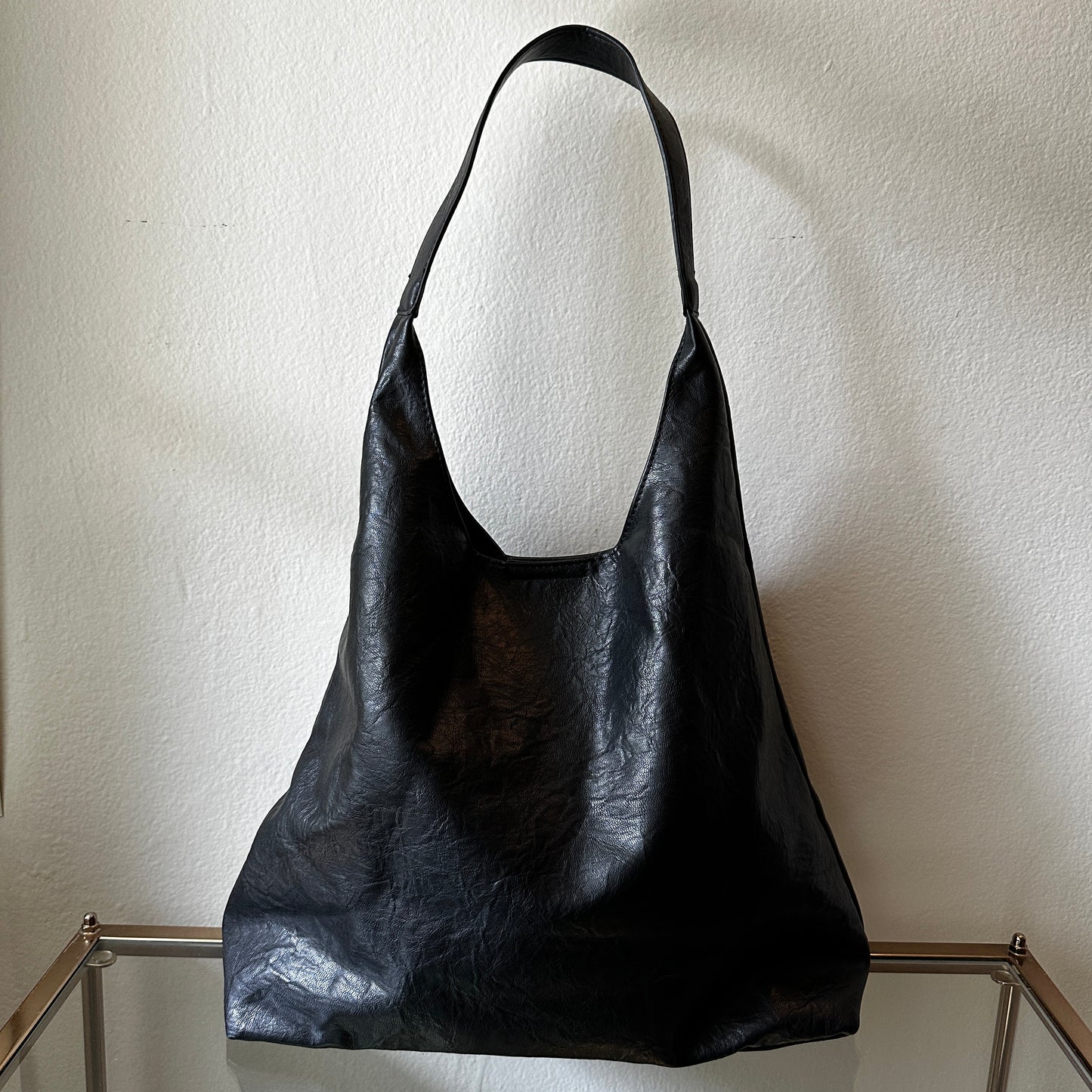 The Black Vegan Leather Shoulder Handbag shown at the front angle