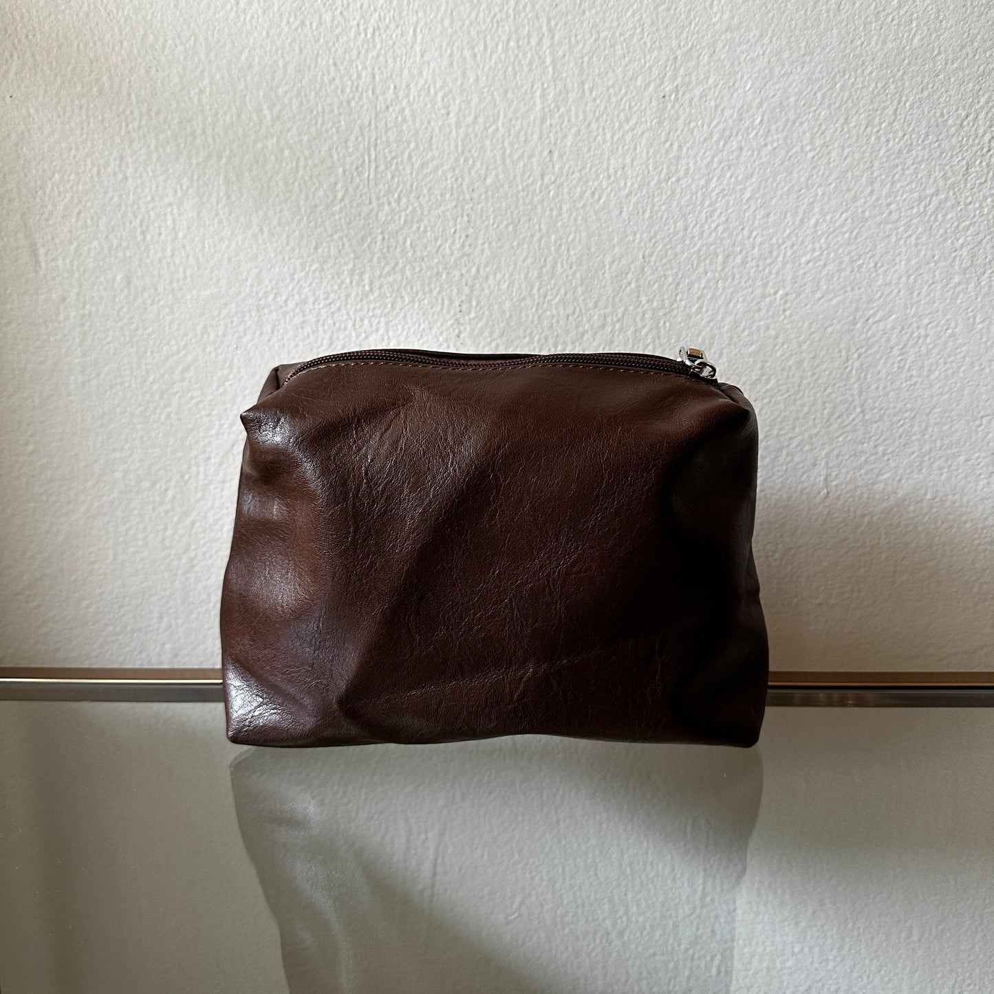 The Brown Vegan Leather Pouch shown close up from the front angle
