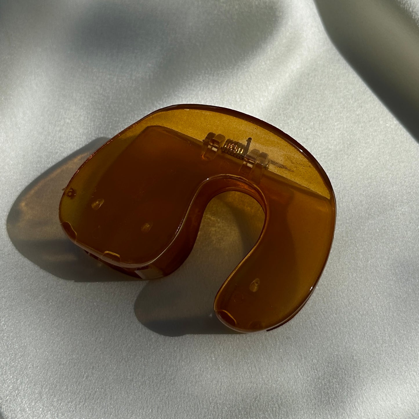 Close up product image of the Jelly U-Shaped Hair Clip in the Amber color